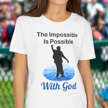 Bella+Canvas youth unisex t-shirt with “Impossible Teen” design featuring a teen walking on water and uplifting message, Christian apparel made from soft cotton, perfect for active wear and spiritual encouragement, girl in white t-shirt